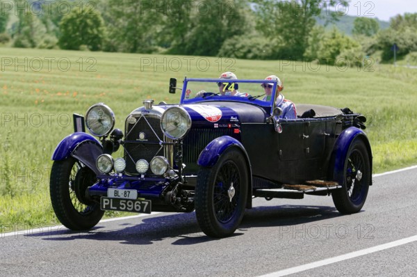 A blue classic car on a country road on a sunny day, classic car, car race, Mille Miglia, 1000