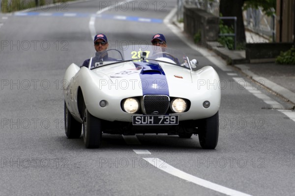 No. 287, Arnolt Bristol Bolide, built in 1954, A white vintage convertible with a blue stripe is