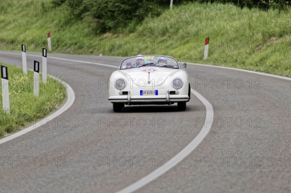 White Porsche convertible classic car on a winding road, classic car, car race, Mille Miglia, 1000