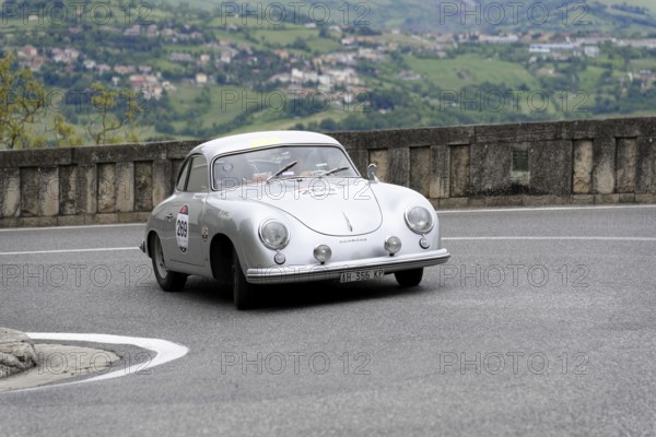 No. 269, Porsche 356 1500, built in 1953, white vintage coupé on a winding road with picturesque