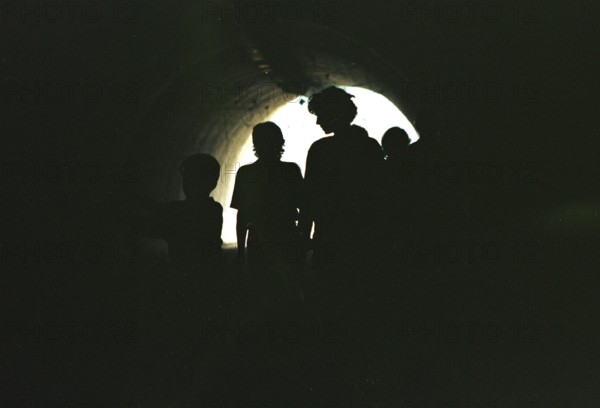 BIH, Sarajevo, 01.09.1995 -- Passers-by walk through an underpass in Sarajevo. During the war