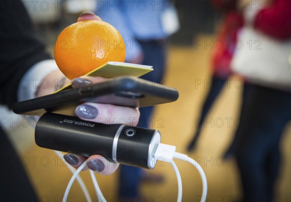 ITA Italy Castelfalfi A participant during a conference for tourism managers with smartphone, power