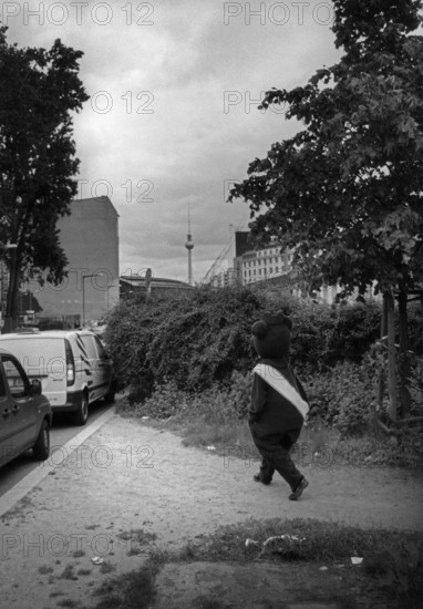 DEU, Germany, Berlin, 12.03.2006, A man wearing a Berlin bear costume heads towards
