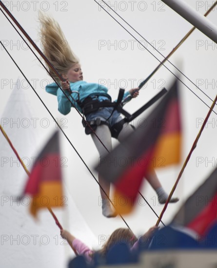 DEU Germany Berlin girls jumping on trampolines. Scene on the eve of the 20th anniversary of German