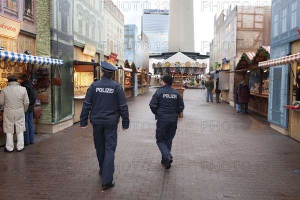 Berlin 2010-11-24 Police officers tour the Christmas market on Alexanderplatz. DEU, Berlin