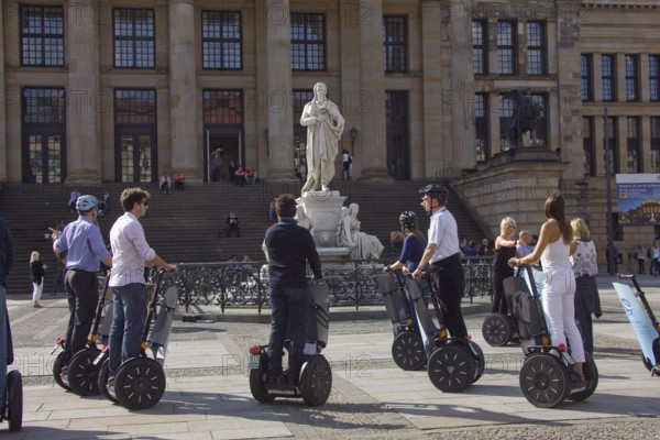 GERMANY Berlin Segway drivers during a guided city tour in front of the Schiller Monument on the