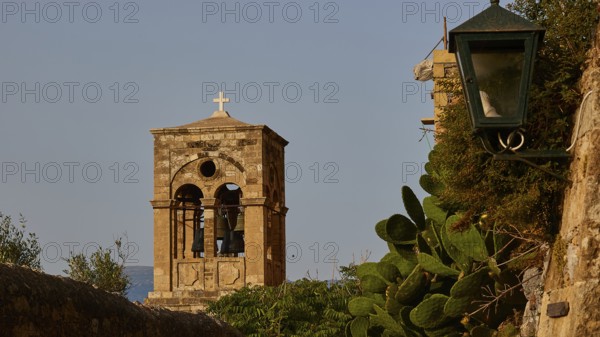 Soft morning light, Holy Church of Christ in Chains, Elkomenos Christos, bell tower with cross next