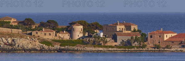 Coastal town with old stone buildings and tiled roofs by the sea, Monemvasia, Monemvassia, Malvasy,