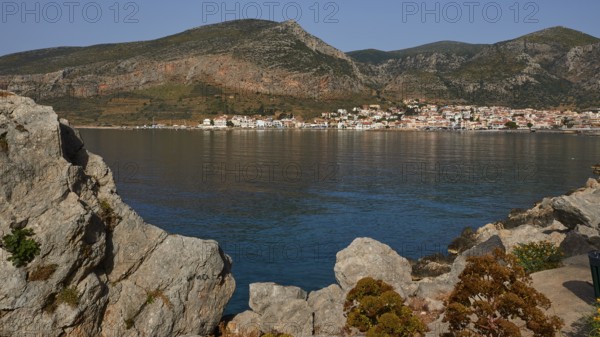 Quiet coastline with mountains in the background and a picturesque village, Monemvasia,