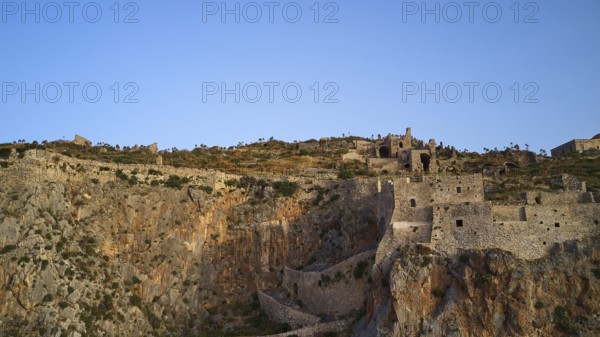 Drone shot, Old rock castle rising above the coastal landscape, Monemvasia, Monemvassia, Malvasy,