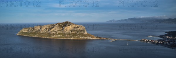 Drone shot, island connected to the mainland by bridge, surrounded by blue water, Monemvasia,