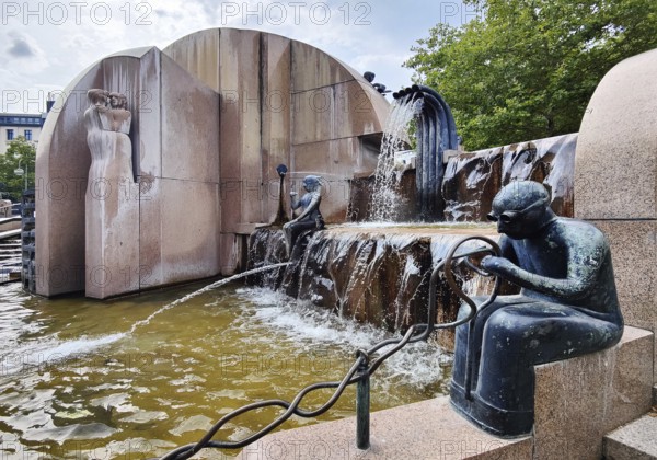 Weltkugelbrunnen with turner in the foreground, also known as Schmettau Fountain or Wasserklops, by