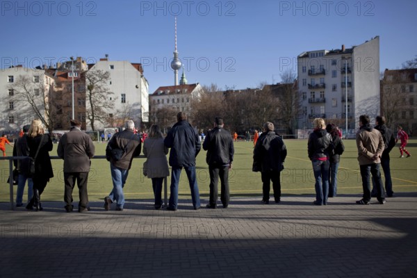 DEU Berlin spectators are watching a soccer game in Berlin-Mitte. Germany Berlin People watching a