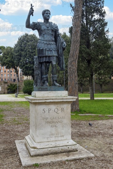 Statue of Emperor Hadrian on pedestal with inscription IMP for Emperor CAESARI HADRIANO AVG