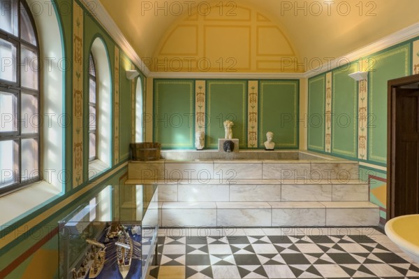 View of reconstructed Roman ancient Roman caldarium hot bath heating room with hot water pool under