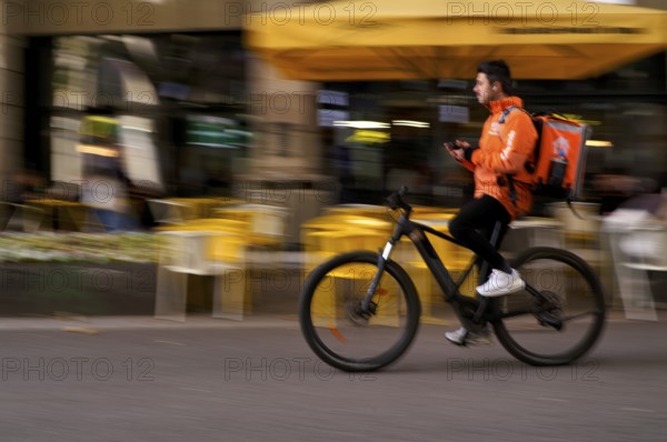 Lieferando, logo, delivery service, courier service, bicycle courier, courier driver rides with