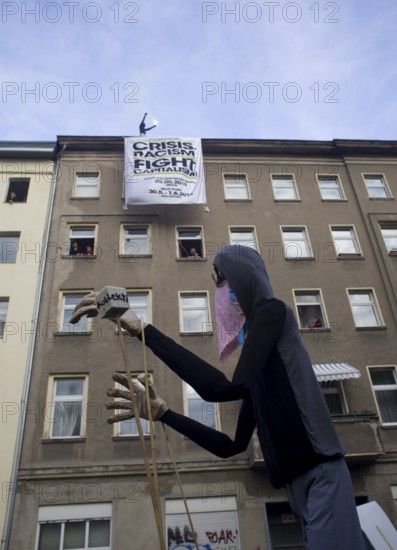 GERMANY Demonstrators march through Kreuzberg with a huge puppet during the May 1 rally. Germany