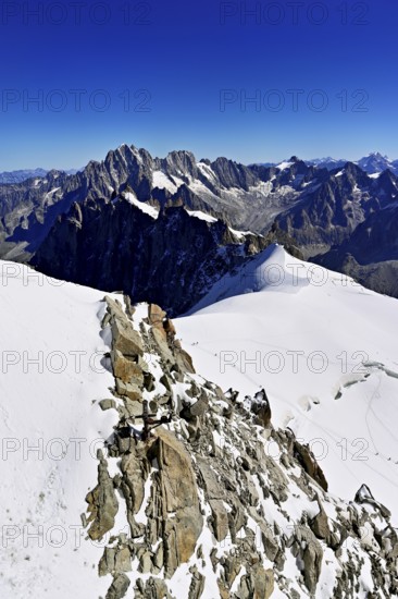 View from the Aiguille du Midi mountain station observation deck of the mountains Aiguille Vert,