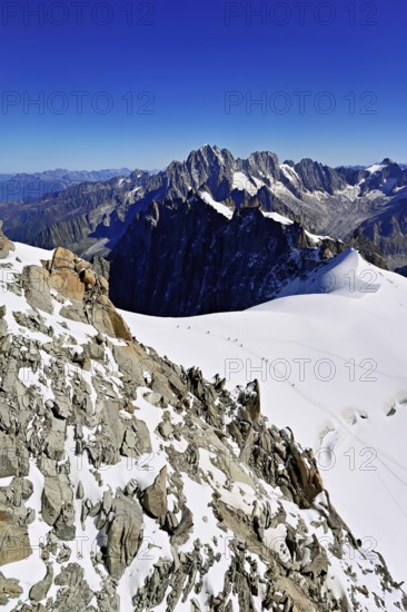View from the Aiguille du Midi mountain station observation deck of the mountains Aiguille Vert,