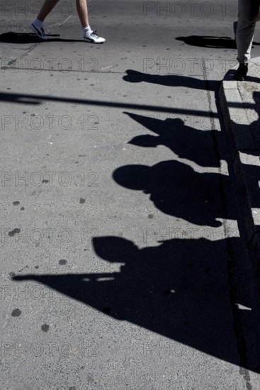 DEU Germany Germany Berlin tourists at Checkpoint Charlie. Shadows of extras disguised as soldiers