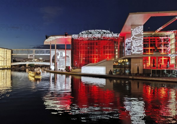 Illuminated Paul Löbe House and Marie Elisabeth Lüders House with the Spree River in the evening,
