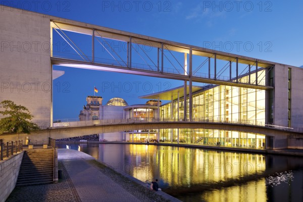 Bridge between Marie-Elisabeth-Lüders-Haus and Paul-Löbe-Haus with the river Spree in the evening,