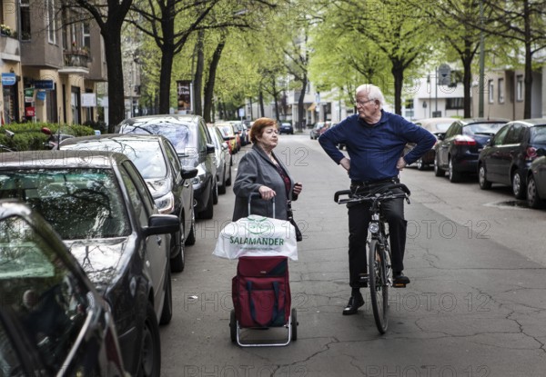 DEU Germany Germany Berlin Neighborhood conversation between an elderly woman with shopping cart