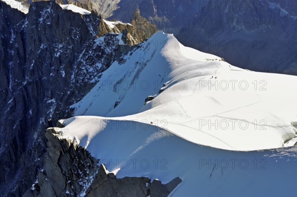 Snow-covered mountain ridge, Aiguille du Midi mountain station viewing platform,