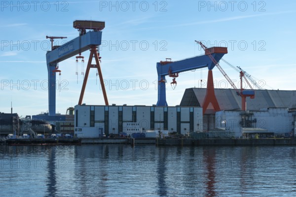 German Naval Yards, shipyard, warehouses, cranes, harbor, Baltic Sea, Kiel Fjord, shipping traffic,