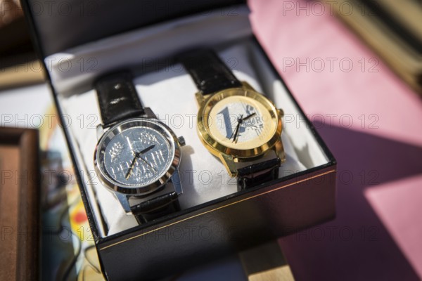 DEU Germany Germany Berlin Clocks with a D-Mark or a euro dial are on a table of a flea market