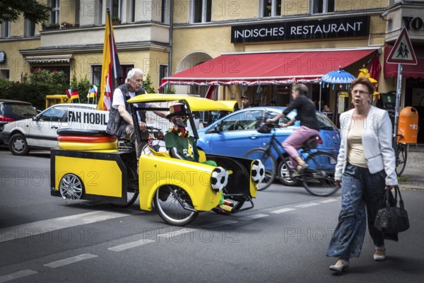 DEU Germany Germany Berlin A man drives through Schöneberg in a self-made European championship
