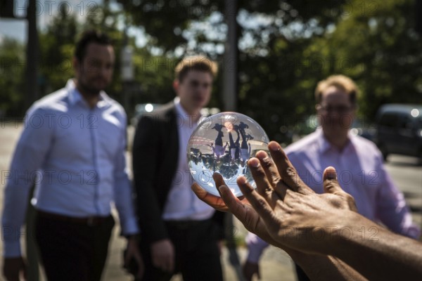 DEU Germany Germany Berlin Juggler with crystal ball works at the intersection opposite the CDU
