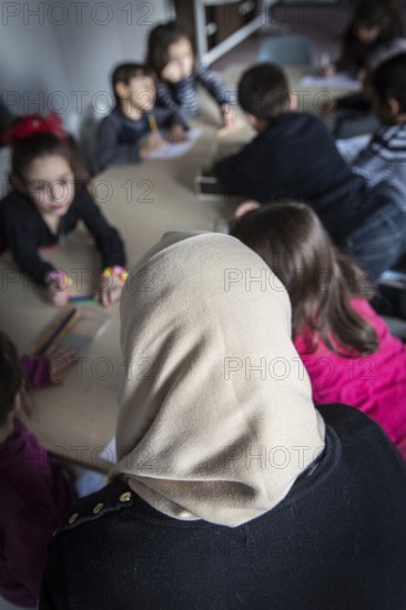 DEU Germany Germany Berlin An animation team entertains refugee children in an asylum center in