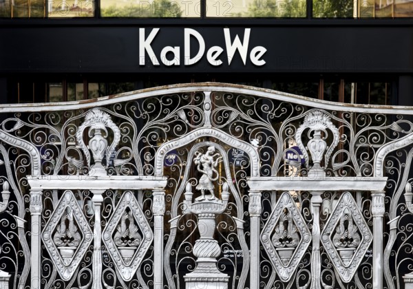 KaDeWe logo, Kaufhaus des Westens, with old forged grid in front of the entrance when the shop is