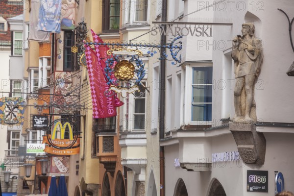 Golden roof, lots of people and historic houses in Herzog-Friedrich-Straße, Altstadt, Innsbruck,