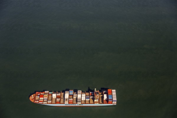 Container ship Maersk Lavras at anchor, aerial view, cargo ships at anchor off Spiekeroog, shipping