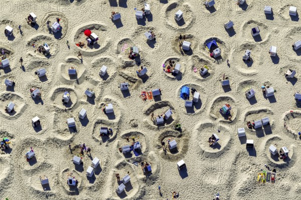 Sandy beach beach with beach chairs and sand walls, sand castles, aerial view, Wangerooge, North