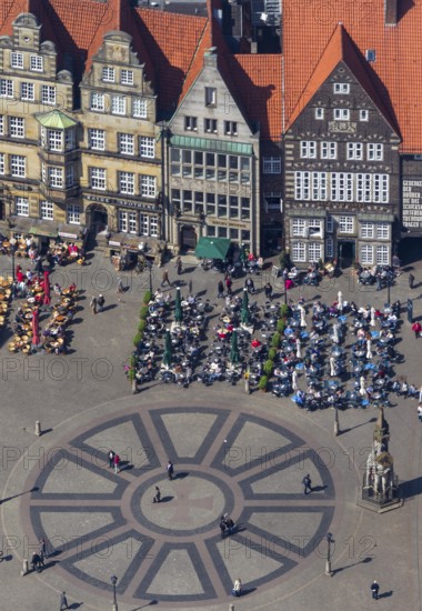 Hanseatic cross in front of the Bremen Roland on the market square of Bremen in front of the town