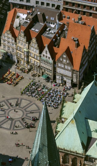 Hanseatic cross in front of the Bremen Roland on the market square of Bremen in front of the town