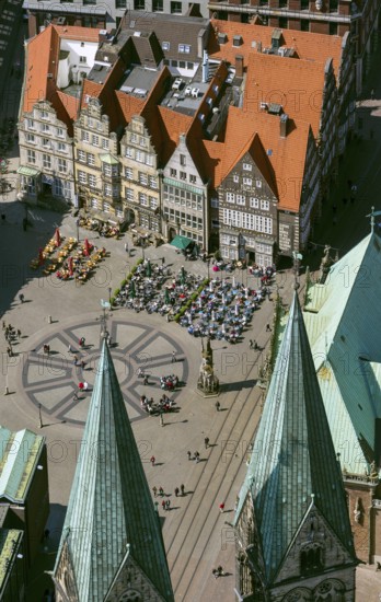 Hanseatic cross in front of the Bremen Roland on the market square of Bremen in front of the town
