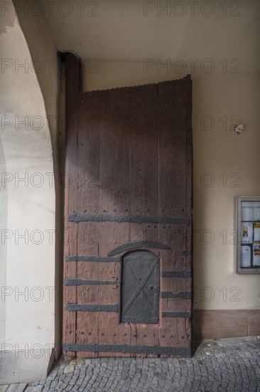 Left side of the wooden gate with manhole at the entrance to the fortified church, around 1500,