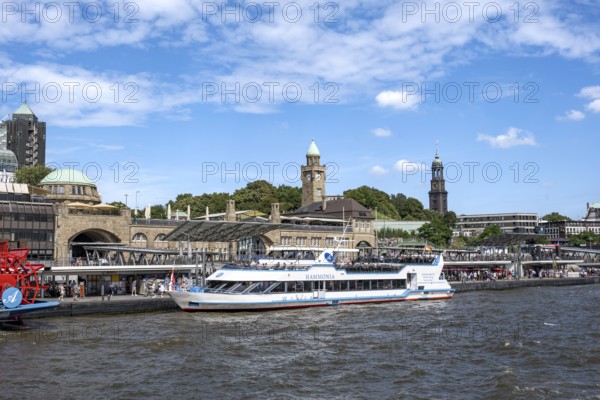 Elbe and boats at St. Pauli Landungsbrücken, historic building with water level tower, Hamburg,