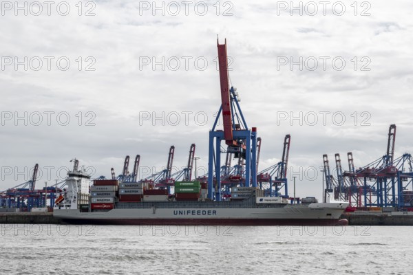 Container ship, loading cranes and stacks of containers, Port of Hamburg, container terminal,