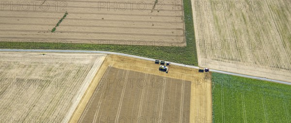 Aerial view, harvesting vehicles with straw bales in Ruploh, grain harvest, fields, Soest, Soester
