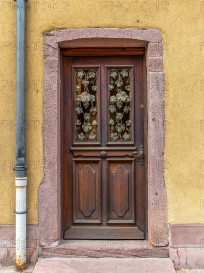 Ornamented door seen in Kaysersberg, a historical town and former commune in Alsace in northeastern