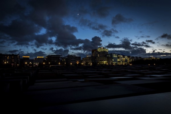 DEU Germany Germany Berlin The Holocaust Memorial at blue hour under a cloudy sky in the direction