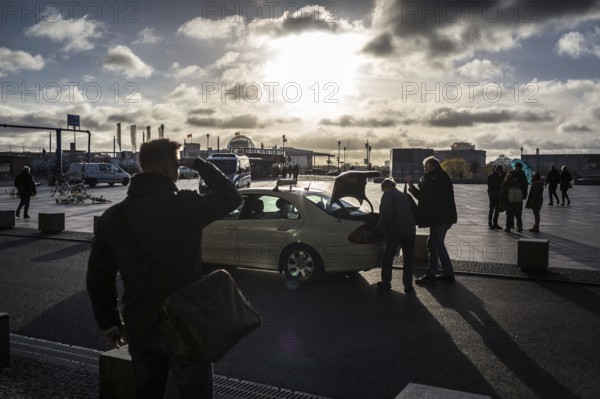 DEU Germany Germany Berlin Traveller looking for a taxi during the EVG strike at the main station