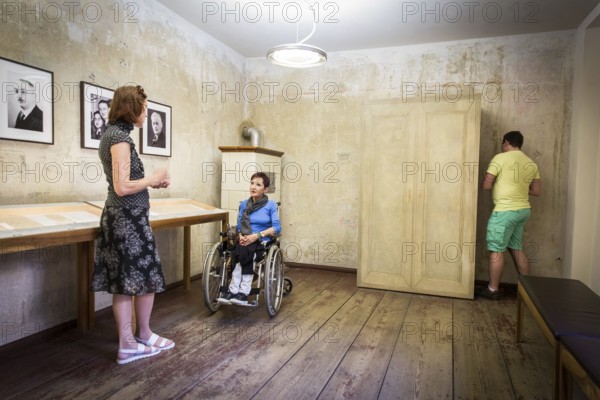DEU Germany Germany Berlin Disabled tourist in a wheelchair explores Berlin with a city guide. Otto