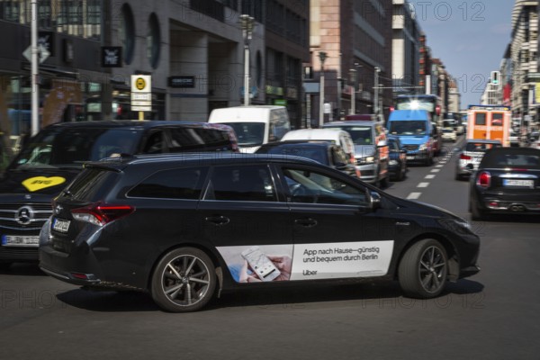 DEU Germany Germany Berlin An Uber taxi on Friedrichsstrasse