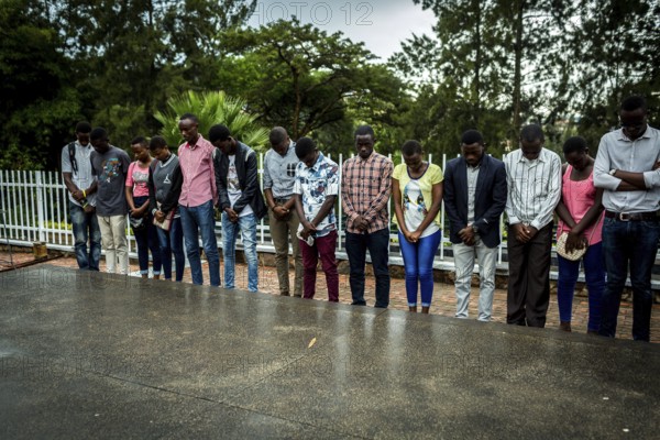 RWA RWANDA RUANDA Kigali A youth group stands in front of a mass grave at the genocide memorial